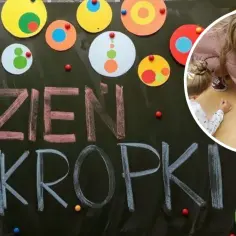 Dzieci tworzą kolorowe kropki na tablicy, świętując Dzień Kropki. Radosna zabawa i kreatywność!