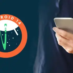 Logo Android 14 z rakietą w kosmosie obok dłoni trzymającej smartfon.