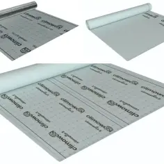 Rolki materiału budowlanego, w tym paroizolacja z aluminiową warstwą odbijającą ciepło.