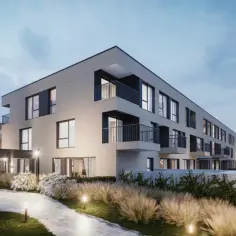 Nowoczesne apartamenty z balkonami, otoczone zielenią i oświetlone wieczorem. Idealne inwestycje w Opolu dla ceniących spokój i styl.