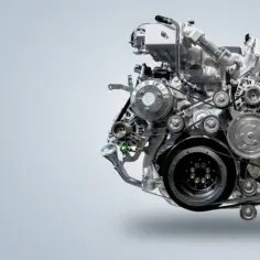 Złożony mechanizm silnika diesla z paskami i kołami pasowymi, ilustrujący, jak działa silnik diesla.