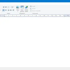 Pusty dokument w programie WordPad, gotowy do pisania. Widoczna linijka z podziałką i menu edycji.