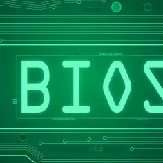 Zielony obwód drukowany z napisem BIOS. Podstawowe oprogramowanie układowe komputera, które inicjuje proces uruchamiania.