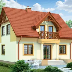 Dom z ceglastym dachem i jasną elewacją, z drewnianym balkonem i tarasem. Otoczony zielenią, z widokiem na góry.