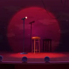 Scena klubu komediowego z mikrofonami i stołkami. Zastanawiasz się, ile zarabia stand-uper?