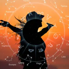 Sylwetka kobiety na tle zachodzącego słońca, otoczona zodiakalnym kołem. Wodnik i Rak tworzą harmonijne dopasowanie.