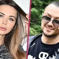 Sandra Kubicka i Baron, modelka z długimi włosami i artysta w okularach przeciwsłonecznych i skórzanych rękawiczkach.