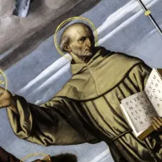 Święty z aureolą trzyma w dłoni symbol IHS, a w drugiej otwartą księgę. Obraz oddaje ducha franciszkanizmu.