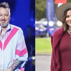 Piotr Kędzierski z żoną. On w kolorowej kurtce, ona w bordowej sukience i kapeluszu.