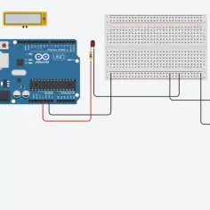 Schemat połączeń Arduino Uno z silnikiem i baterią 9V. Widać płytkę styków, diodę LED i miernik. GND to punkt wspólny masy.