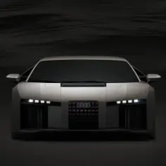 Przód futurystycznego Audi RS8 w kolorze srebrnym, z ostrymi światłami LED i charakterystycznym grillem.