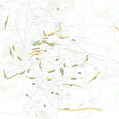 Mapa Łodzi z zaznaczonymi na zielono i pomarańczowo ulicami.
