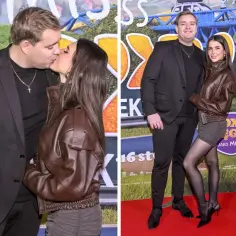 Kevin Mglej i jego partnerka na premierze filmu. Ona w brązowej kurtce, on w garniturze.