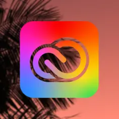 Logo Adobe Creative Cloud z tęczowym gradientem, na tle cienia liści palmy.