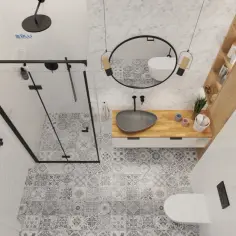 Wzorowa łazienka z prysznicem walk-in, umywalką nablatową i toaletą. Wnętrze zdobią geometryczne płytki i drewniane elementy.