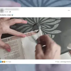 Ręce szukają, gdzie jest chip w paszporcie polskim. Widoczny fragment dokumentu z tekstem.