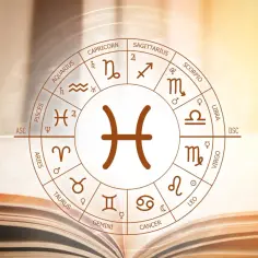 Koło zodiaku z symbolem Ryb w centrum. 2 marca znak zodiaku to Ryby, symbolizujące intuicję i marzycielstwo.