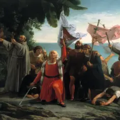 Krzysztof Kolumb klęczy z flagą, otoczony przez żeglarzy i tubylców, na tle statków.