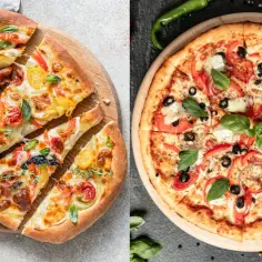 Dwie pizze: jedna pokrojona na kawałki z pomidorkami, druga w całości z papryką i oliwkami.