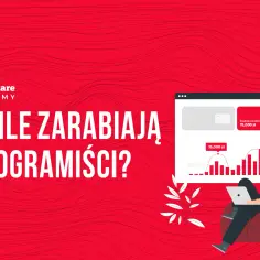 Młody programista siedzi na pufie z laptopem, analizując wykresy średnich zarobków.