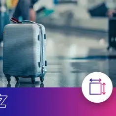 Szary walizka, idealna na wizzair bagaż podręczny, stoi na lotnisku. Obok ikony wymiarów i wagi.