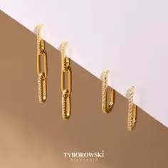 Eleganckie, złote kolczyki z cyrkoniami, przypominające ogniwa łańcuszka. Idealne dla kobiety ceniącej wyrafinowany styl.