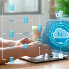 Ręce piszą na laptopie, z którego wychodzi sieć ikon dokumentów i folderów, symbolizująca **appcloud**.