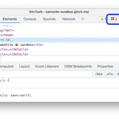 Widok DevTools z sekcją Elements, pokazujący kod HTML i style. W prawym górnym rogu widać ikonę błędu z liczbą 2.