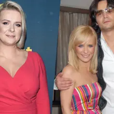 Aneta Zając w czerwonej sukience obok swojego obecnego partnera, który ma na sobie białą koszulę i czarną kurtkę.