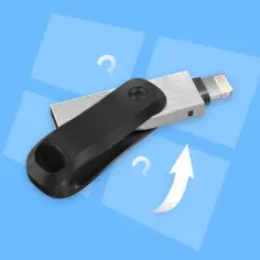 Pendrive z wtyczką Lightning i USB. Pytajniki i strzałka w górę sugerują, jak sformatować komputer, by odzyskać przestrzeń.