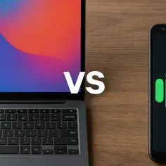 Laptop z kolorowym tłem obok smartfona z logo Android. Porównanie systemów, np. Chrome OS z Androidem.