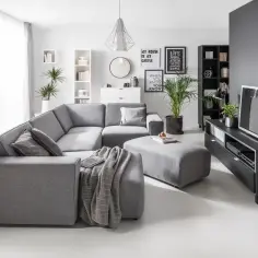 Jak urządzić salon w szarościach, by uniknąć zimnej atmosfery?
