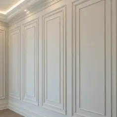 Elegancka sztukateria na ścianie tworzy subtelne wzory, dodając wnętrzu klasy.