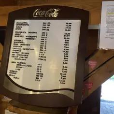 Menu w grill bar chałupa: gulaszowa, borowikowa, żurek, rosół, polędwica wołowa, łosoś, szaszłyk wieprzowy, golonka, karkówka, filet drobiowy, kiełbasa, kapusta, surowka, ogórek kiszony, sos czosnkowy, ketchup, chrzan, musztarda, kawa, herbata, kompot,...