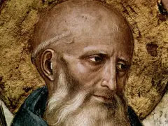Close-up of St. Benedict the Abbot, a wise elder with a golden halo, his gaze thoughtful.