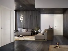 Interni moderni con infissi marroni e porte bianche. Un salotto accogliente con divani grigi, tappeto beige e un'elegante lampada a sospensione.
