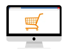 Monitor z ikoną koszyka zakupowego, symbolizujący branżę e-commerce i zakupy online.