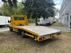 Żółta autolaweta gotowa do pracy. Chcesz wiedzieć, jak zdobyć zlecenia na autolawetę? Ten pojazd to Twój pierwszy krok do sukcesu.