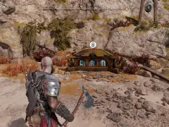 Kratos se acerca al cofre de las Nornas, custodiando las arenas prohibidas. Runas brillan en su superficie, prometiendo secretos.