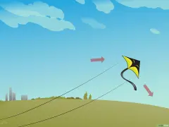 Un cerf-volant jaune et noir s'envole dans un ciel bleu. Une activité manuelle pour s'amuser dehors.