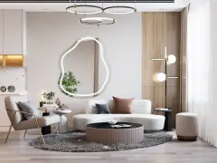 Nowoczesny salon z fotelem, sofą i stolikami. Lustro o nieregularnym kształcie przypomina cloud dancer.