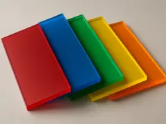 Five colored acrylic sheets (red, blue, green, yellow, orange) arranged in a row, demonstrating how to layer resin without lines for a smooth, vibrant finish.