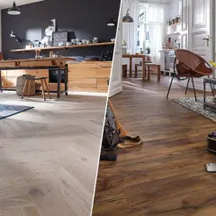Vergleich von hellem Parkett im Fischgrätmuster mit dunklem Laminatboden. Der Unterschied zwischen Laminat und Parkett wird hier deutlich.