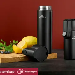 Dwa czarne termosy Gerlach, cytryny, mięta i borówki na desce. Czy termos można myć w zmywarce? Sprawdź nasze naczynia termiczne.