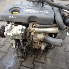 Silnik Opel Astra H z widocznym kompresorem klimatyzacji i oznaczeniem Ecotec.