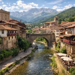 Un pueblo con encanto en Cantabria, con un río que lo atraviesa, un puente medieval y casas de piedra con balcones floridos. ¡Pura magia!