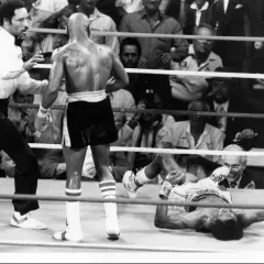 Referee watches as one boxer is down during the Hearns vs Hagler fight.