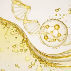 Złote kuleczki i struktura DNA, symbolizujące peptydy miedziowe, unoszą się w płynnej, oleistej substancji.