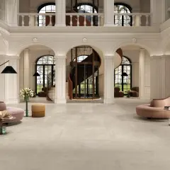 Hall d'entrée luxueux avec un carrelage au sens de pose carrelage 60x120, des arches, un ascenseur hélicoïdal et des meubles design.