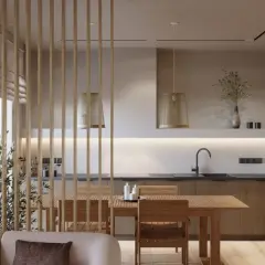 Drewniane, mobilne ścianki działowe subtelnie oddzielają salon od kuchni z jadalnią.